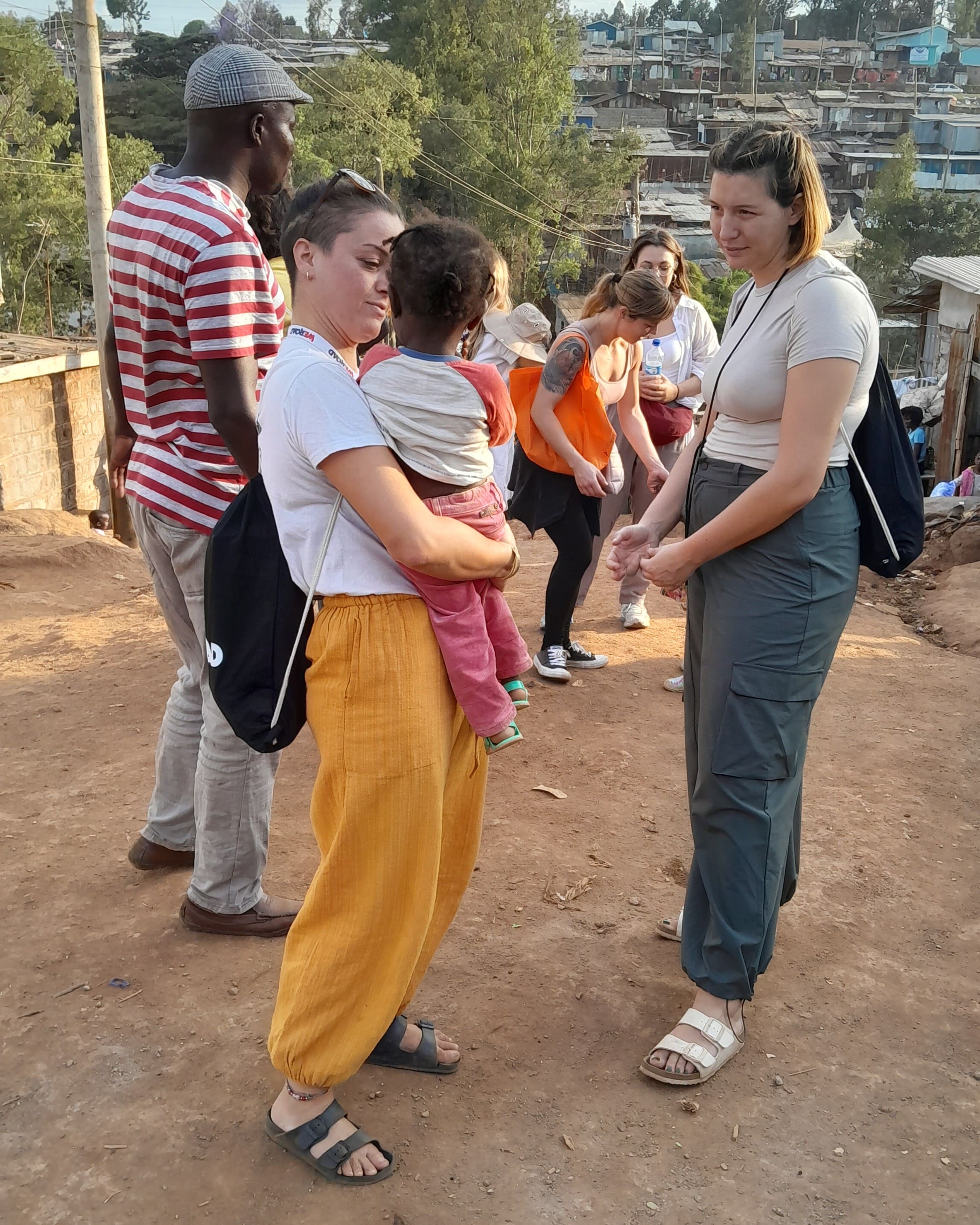 tourists chating in kibera